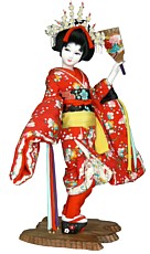 японская кукла, изображающая майко с ракеткой хогоита для игры в воланы